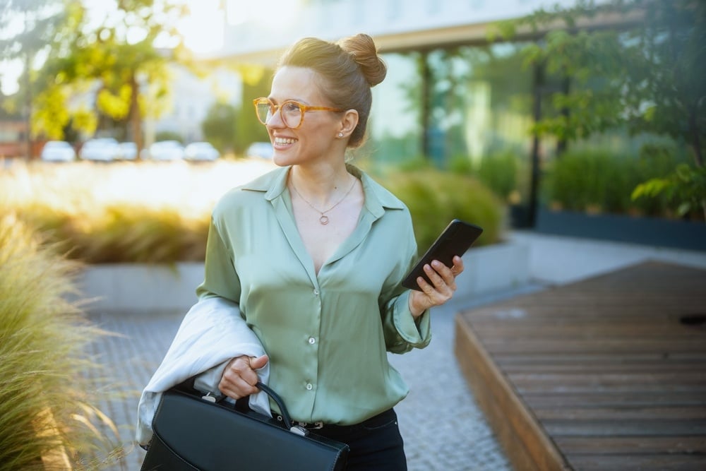 woman happy with green loans and sustainable finance